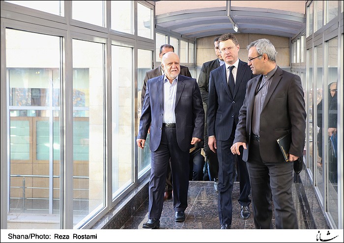 Iran signed preliminary agreements with Russia's Gazprom on Tuesday to develop two major oilfields in the latest of a flurry of deals with foreign firms, local media reported.